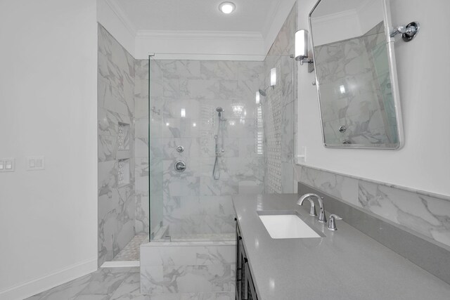545 Sebastian Sq, Saint Augustine, FL 32095 - bathroom with a marble finish shower, crown molding, marble look tile flooring, vanity, and baseboards