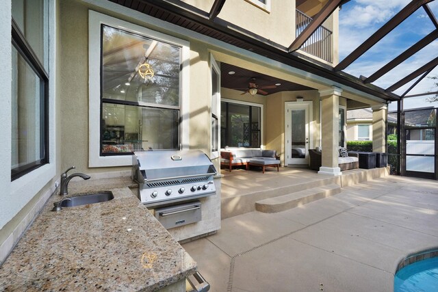 545 Sebastian Sq, Saint Augustine, FL 32095 - view of patio / terrace featuring a sink, ceiling fan, an outdoor living space, glass enclosure, and a balcony