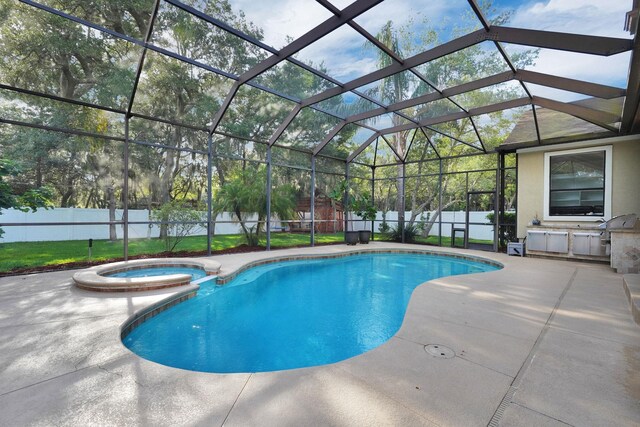 545 Sebastian Sq, Saint Augustine, FL 32095 - view of swimming pool with a patio area, a pool with connected hot tub, a fenced backyard, and glass enclosure