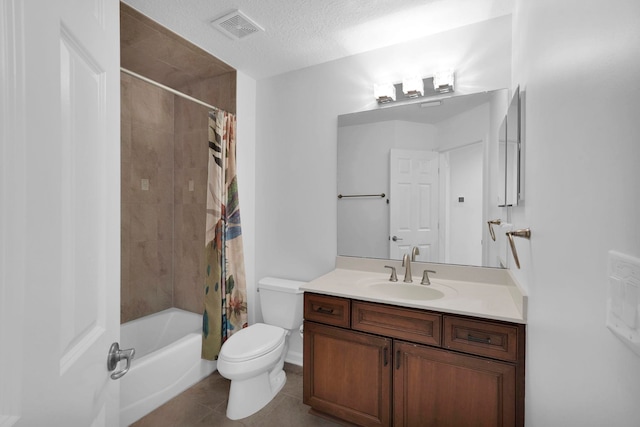 545 Sebastian Sq, Saint Augustine, FL 32095 - full bathroom with toilet, vanity, tile patterned flooring, shower / tub combo with curtain, and a textured ceiling