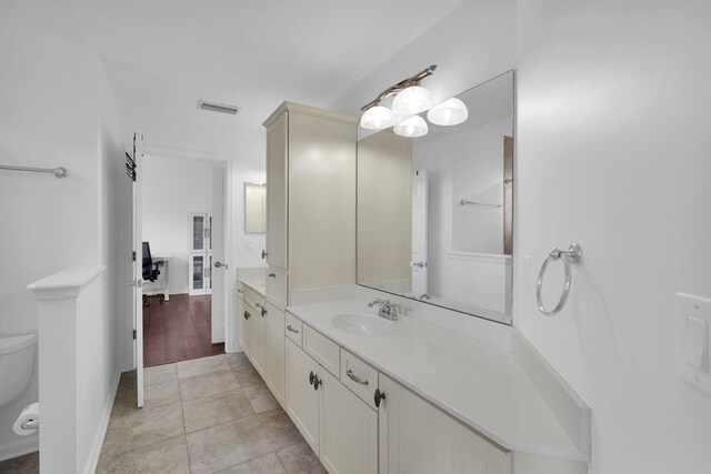 545 Sebastian Sq, Saint Augustine, FL 32095 - bathroom with toilet, vanity, and baseboards