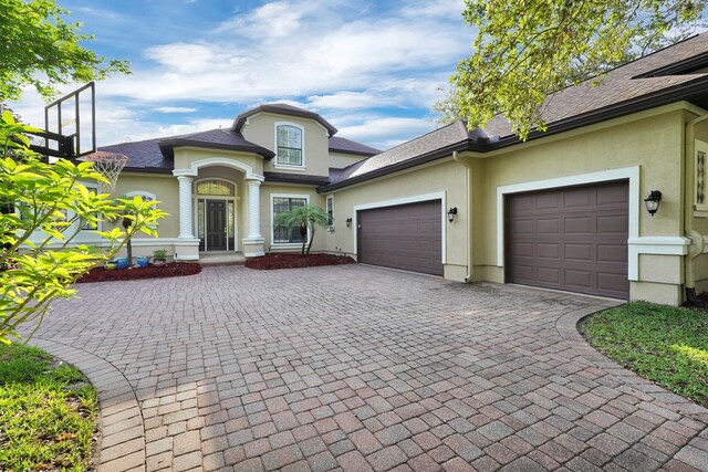 545 Sebastian Sq, Saint Augustine, FL 32095 - view of front of property with stucco siding, decorative driveway, and a garage