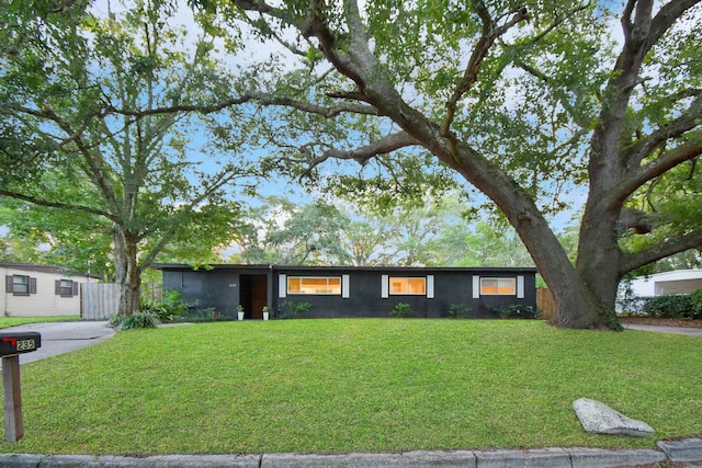 235 N Whitney St, Saint Augustine, FL 32084 - ranch-style house featuring a front lawn