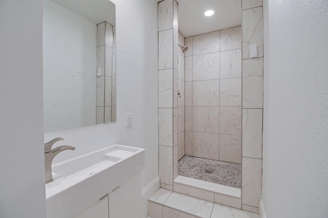 235 N Whitney St, Saint Augustine, FL 32084 - full bathroom with tiled shower, vanity, and marble finish floors