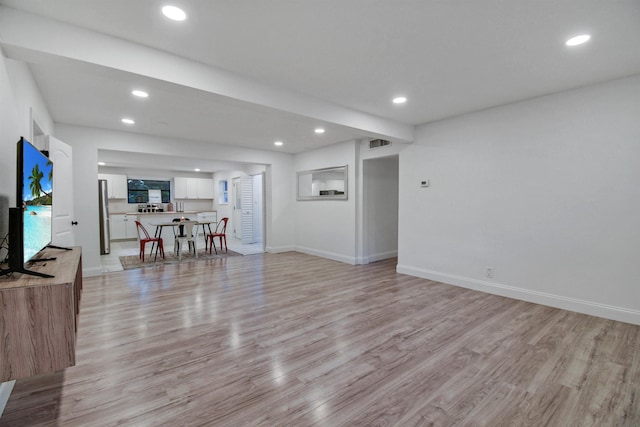 235 N Whitney St, Saint Augustine, FL 32084 - living room featuring light wood finished floors and recessed lighting
