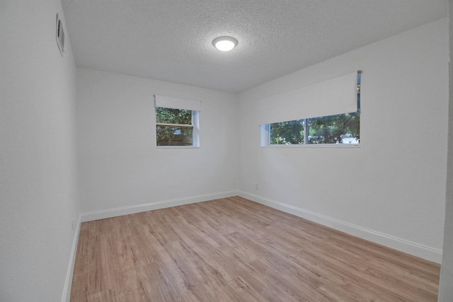 235 N Whitney St, Saint Augustine, FL 32084 - spare room with a textured ceiling and light wood-type flooring