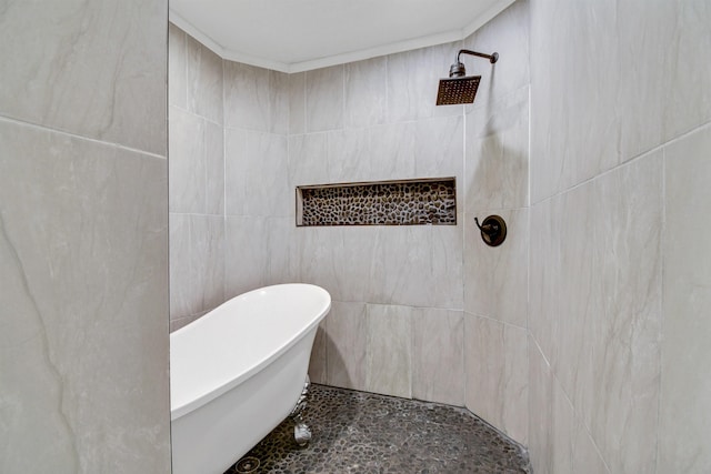 235 N Whitney St, Saint Augustine, FL 32084 - bathroom featuring a tile shower and a freestanding tub