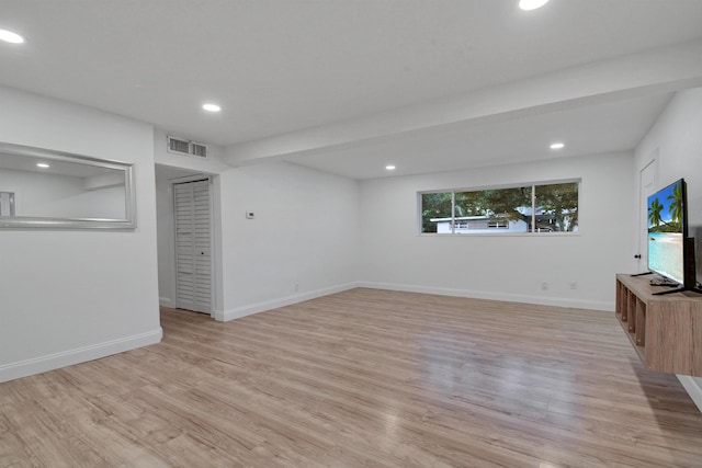 235 N Whitney St, Saint Augustine, FL 32084 - unfurnished living room with recessed lighting and light wood-style floors