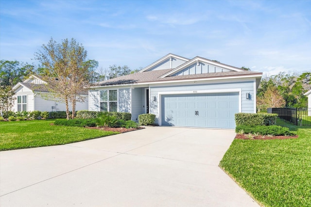 ranch-style house with a front yard and a garage