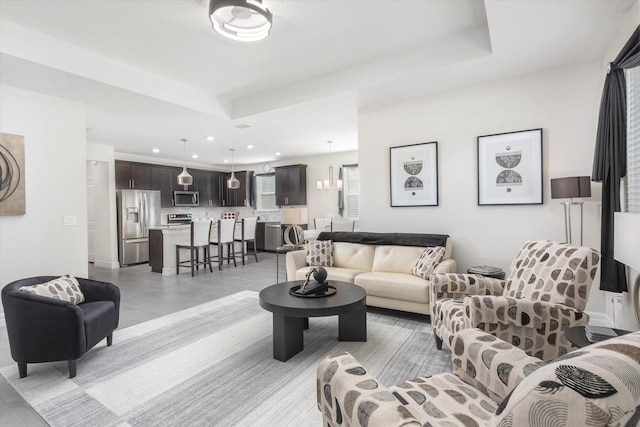 living room with a tray ceiling