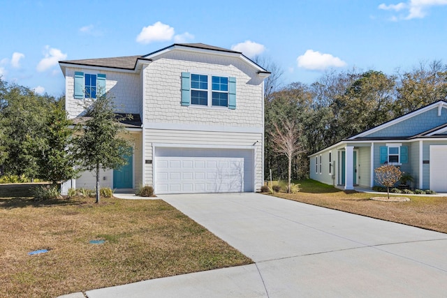 view of front of property featuring a garage and a front lawn