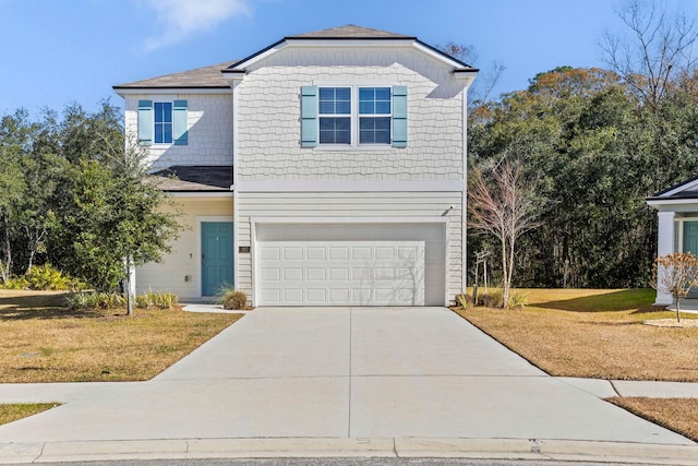 view of front of house with a garage and a front lawn