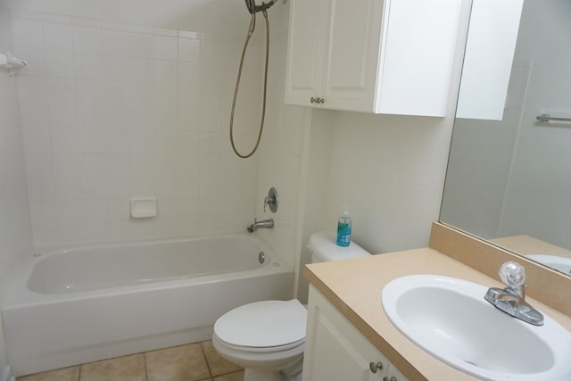 full bathroom with tile patterned floors, tiled shower / bath combo, toilet, and vanity