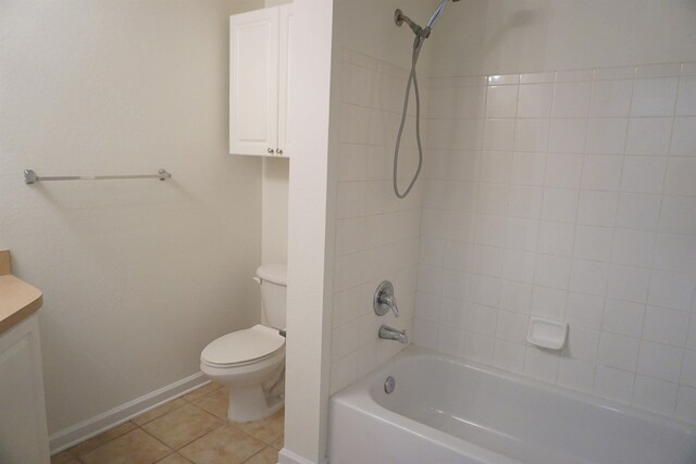 full bathroom with tile patterned flooring, vanity, toilet, and tiled shower / bath