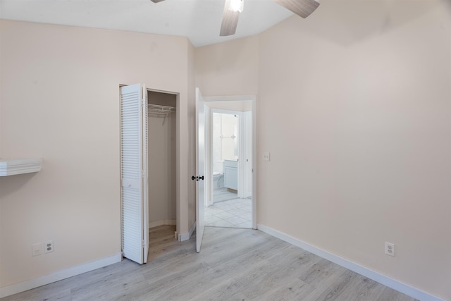 unfurnished bedroom featuring a closet, ceiling fan, and light hardwood / wood-style flooring