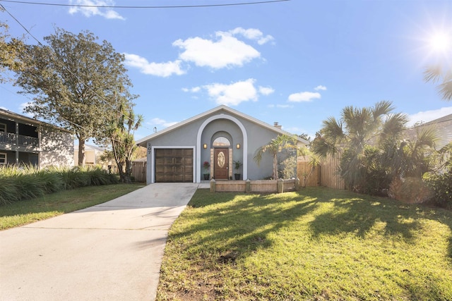 view of front of property featuring a garage and a front yard