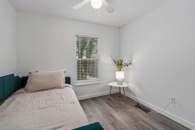 19 Phillips St, Saint Augustine, FL 32084 - bedroom featuring visible vents, baseboards, a ceiling fan, and wood finished floors