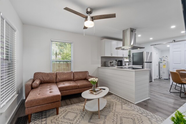 19 Phillips St, Saint Augustine, FL 32084 - living area featuring ceiling fan, electric water heater, light wood finished floors, recessed lighting, and a toaster