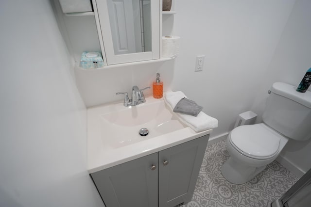 19 Phillips St, Saint Augustine, FL 32084 - half bath with toilet, vanity, baseboards, and tile patterned flooring