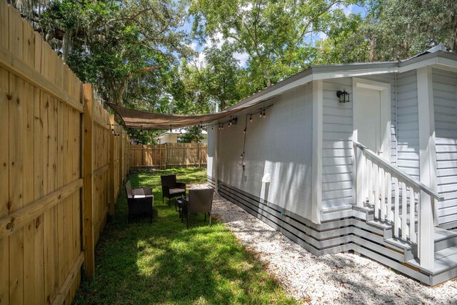 19 Phillips St, Saint Augustine, FL 32084 - view of side of property with fence and a lawn