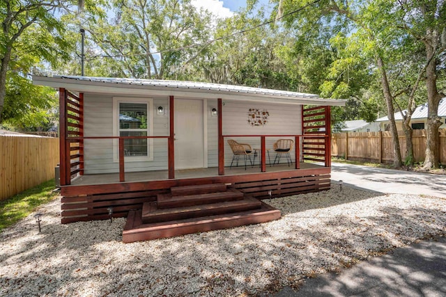 19 Phillips St, Saint Augustine, FL 32084 - view of front of home featuring fence and metal roof