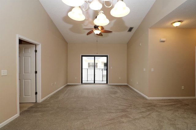 carpeted empty room featuring ceiling fan with notable chandelier