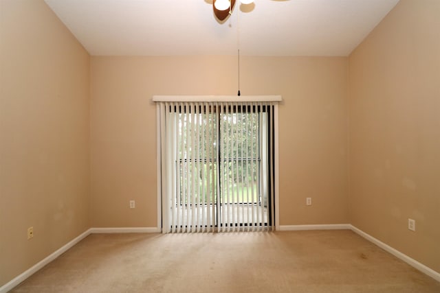 carpeted empty room with ceiling fan