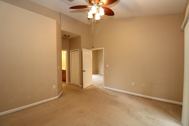 carpeted empty room with ceiling fan