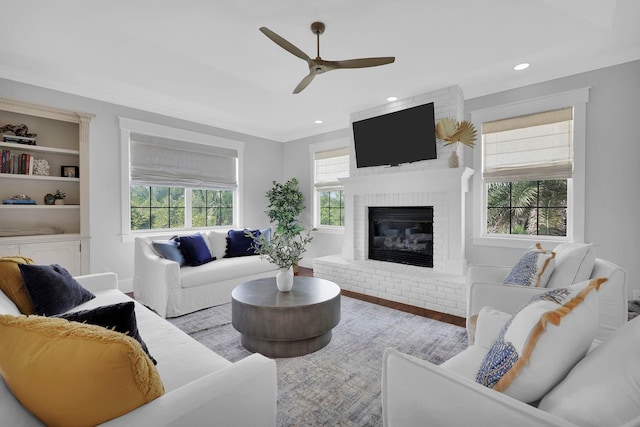 living room with recessed lighting, wood finished floors, a fireplace, and ceiling fan