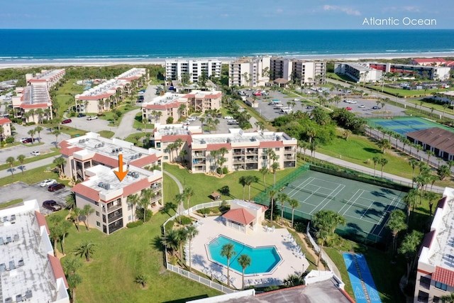 bird's eye view featuring a view of the beach and a water view