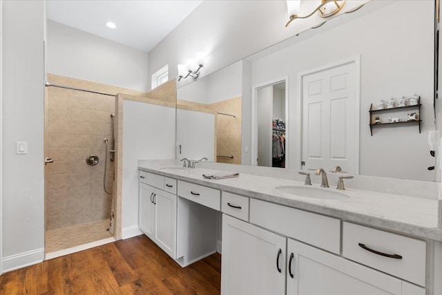 552 Christina Dr, Saint Augustine, FL 32086 - full bath with double vanity, a sink, walk in shower, and wood finished floors