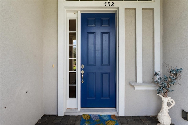 552 Christina Dr, Saint Augustine, FL 32086 - view of exterior entry featuring stucco siding