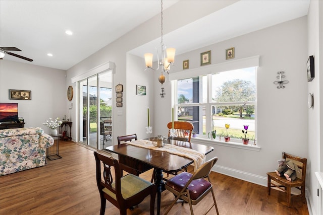 552 Christina Dr, Saint Augustine, FL 32086 - dining area with baseboards, wood finished floors, recessed lighting, and ceiling fan with notable chandelier