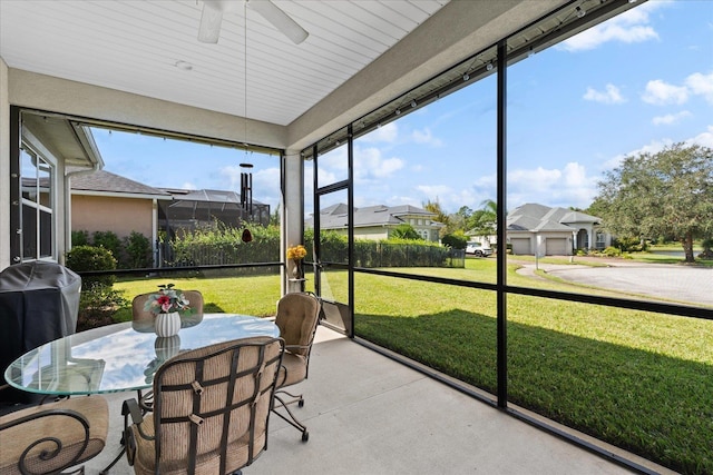552 Christina Dr, Saint Augustine, FL 32086 - sunroom / solarium with outdoor dining area, a ceiling fan, and a residential view