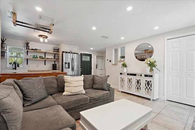 56 Dumas St, Saint Augustine, FL 32084 - living room featuring indoor bar, light tile patterned floors, baseboards, visible vents, and recessed lighting