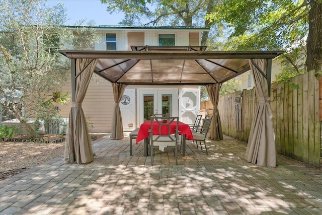 56 Dumas St, Saint Augustine, FL 32084 - view of patio with a gazebo, outdoor dining area, and fence