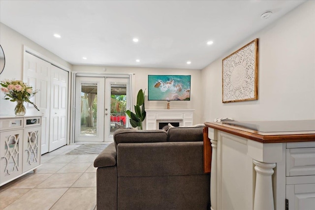 56 Dumas St, Saint Augustine, FL 32084 - living area with light tile patterned floors, recessed lighting, a fireplace, and french doors