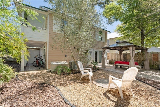 56 Dumas St, Saint Augustine, FL 32084 - rear view of property with a gazebo and a patio