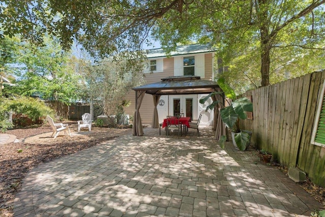56 Dumas St, Saint Augustine, FL 32084 - exterior space featuring a fenced backyard, outdoor dining space, a patio area, and french doors