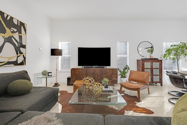 living room with tile patterned floors