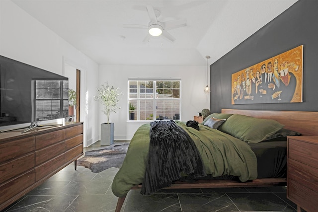 bedroom featuring ceiling fan and vaulted ceiling