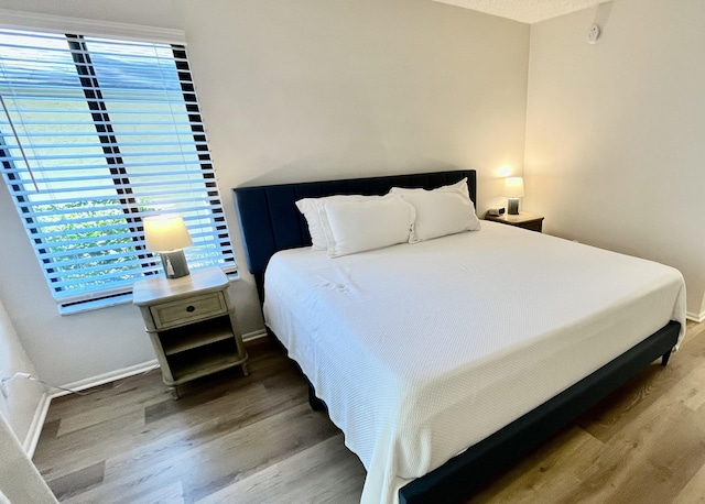 bedroom featuring hardwood / wood-style flooring