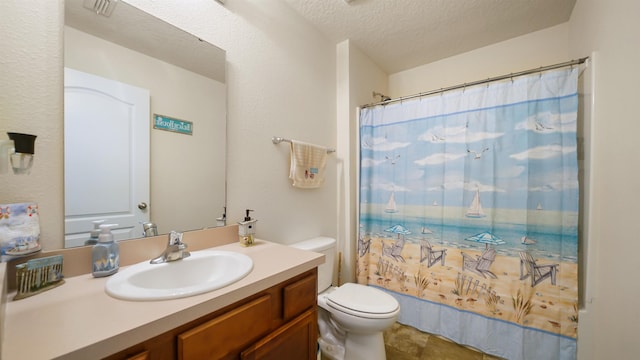 bathroom with a shower with curtain, vanity, toilet, and a textured ceiling