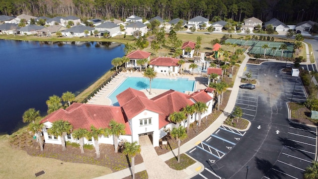 birds eye view of property featuring a water view