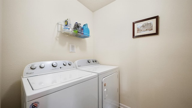 laundry area featuring laundry area and washer and clothes dryer