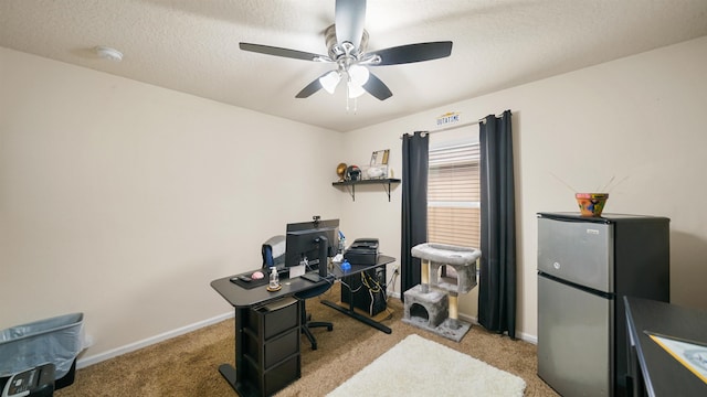 office space with light carpet, ceiling fan, and baseboards