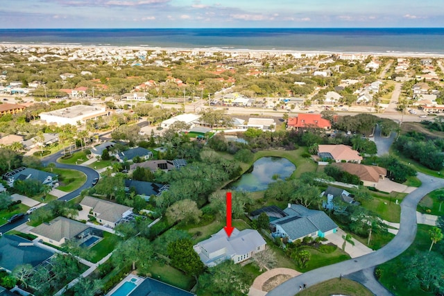 bird's eye view featuring a residential view and a water view