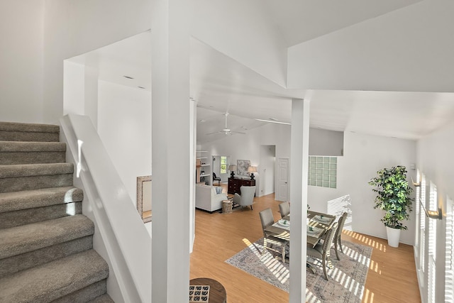10 Marshview Dr, Saint Augustine, FL 32080 - stairs featuring a ceiling fan, wood finished floors, and high vaulted ceiling