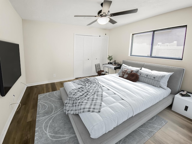 bedroom featuring hardwood / wood-style flooring, ceiling fan, and a closet