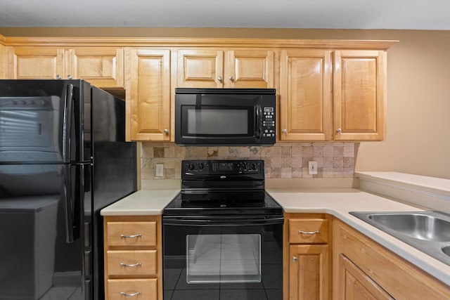 kitchen with light brown cabinets, black appliances, tile patterned floors, sink, and tasteful backsplash